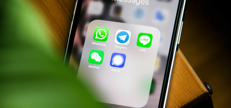 mobile phone with messenger apps on home screen