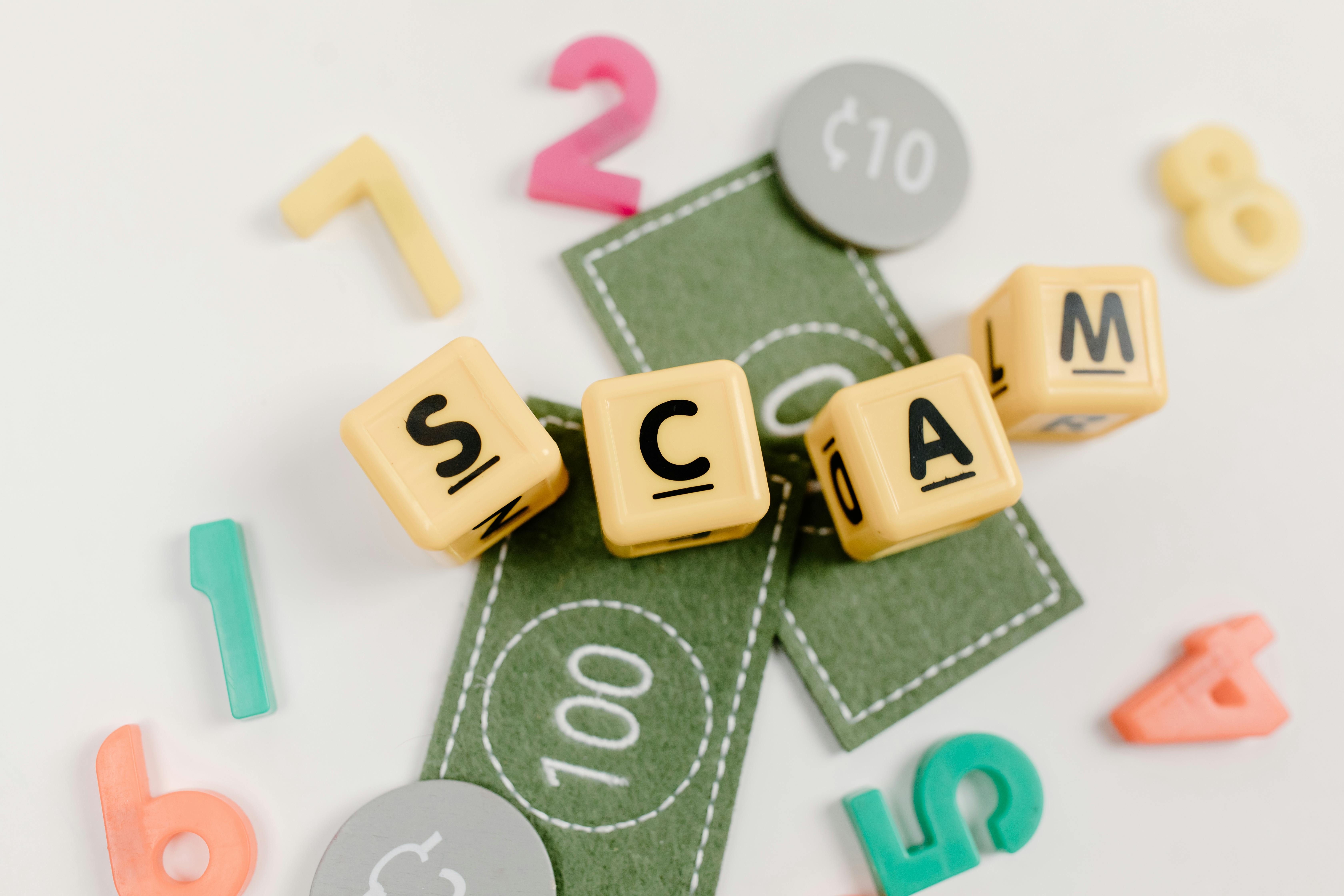Scam written in wooden letters
